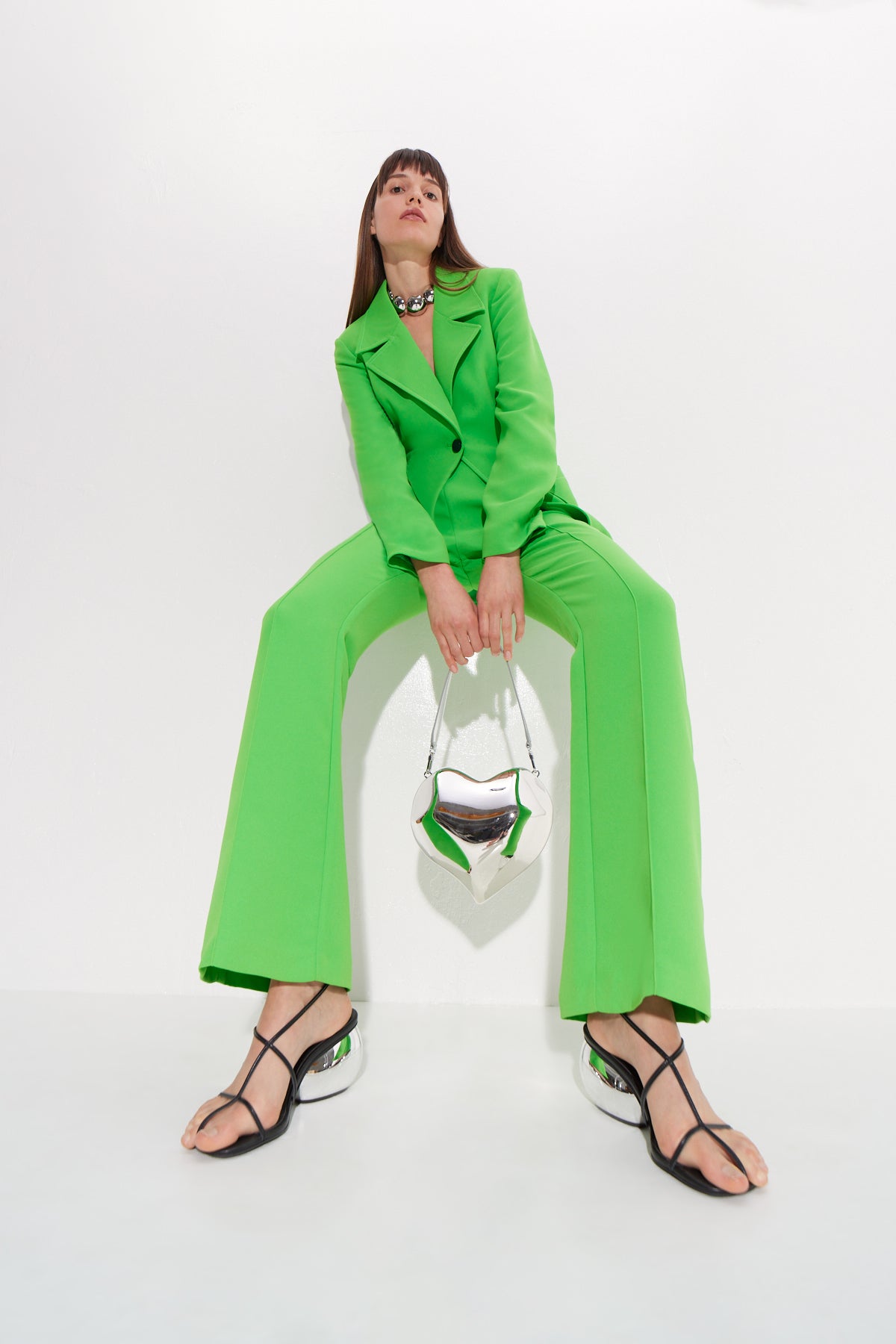 W6072-SOLA-CREPE-BLAZER-GUMMY-GREEN-WITH-MOLDED-HEAR-BAG-SILVER-FULL-BODY-SHOT-ANGLED-UP